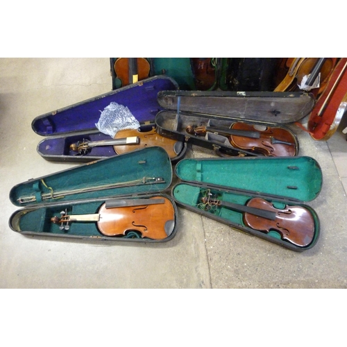 342 - Nine cased violins