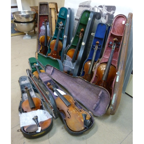 343 - Eight cased violins