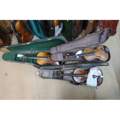 343 - Eight cased violins