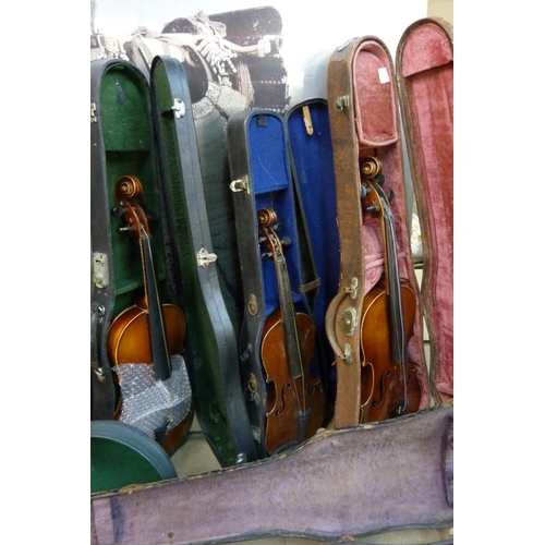 343 - Eight cased violins