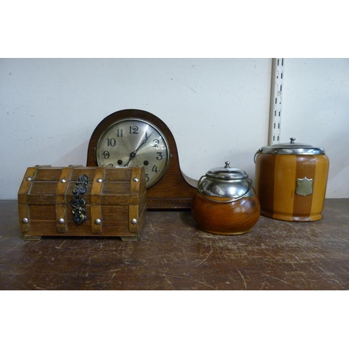 371 - An oak mantel clock, treen, etc.