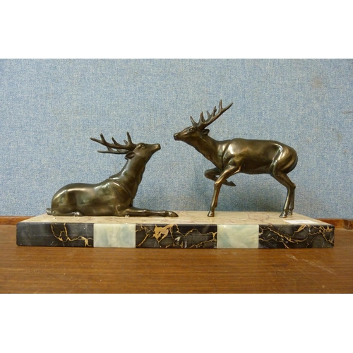 374 - A French Art Deco figure group of stags on marble socle