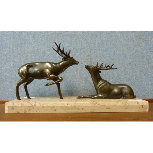 374 - A French Art Deco figure group of stags on marble socle