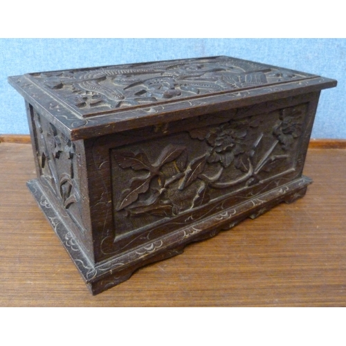 379 - A Chinese 19th Century carved hardwood box with dragon motif