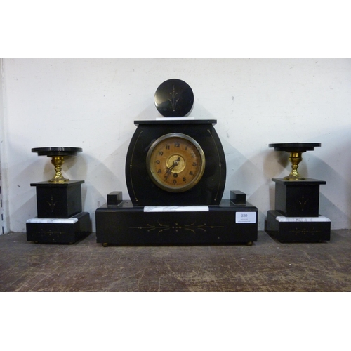 380 - A French Art Deco Belge noir clock garniture