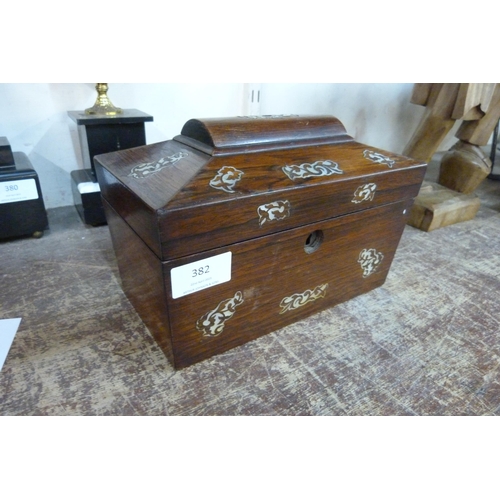 382 - A Victorian rosewood and mother of pearl inlaid sarcophagus shaped tea caddy