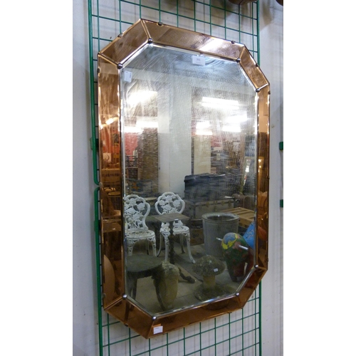 391 - An Art Deco peach glass bevelled mirror