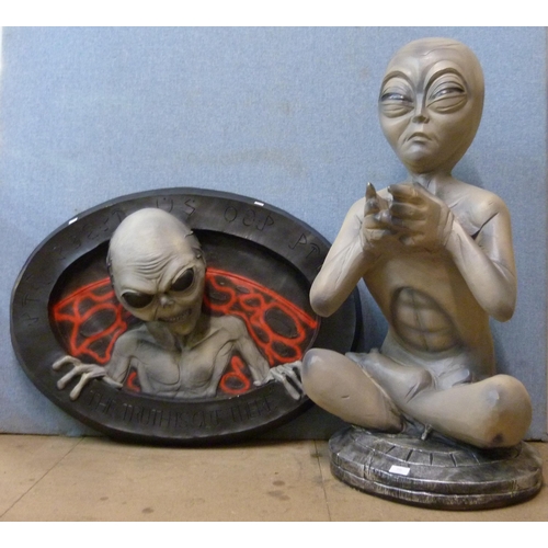 396 - A painted fibreglass figure of an alien and wall plaque