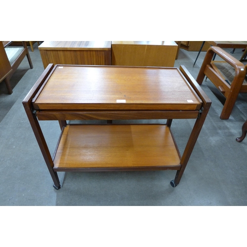 40 - A teak metamorphic trolley