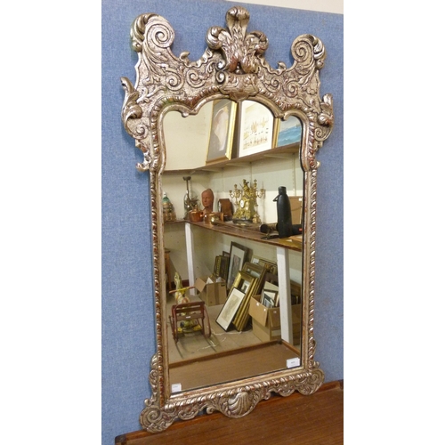 409 - A 18th Century style silver painted mirror