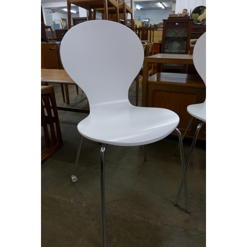 40D - A set of four Arne Jacobsen style white bent ply wood and chrome chairs and two similar