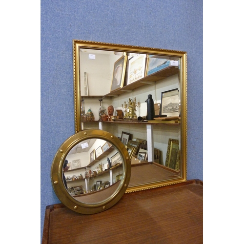 410 - A brass port hole style mirror and one other