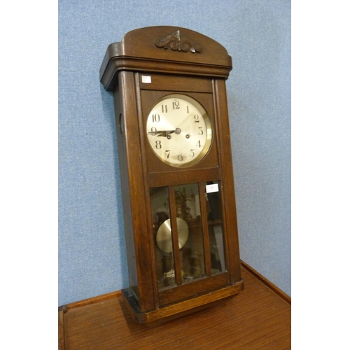 416 - An Edward VII oak cased wall clock