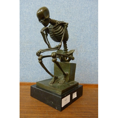 422 - After Milo, bronze skeleton on black marble socle