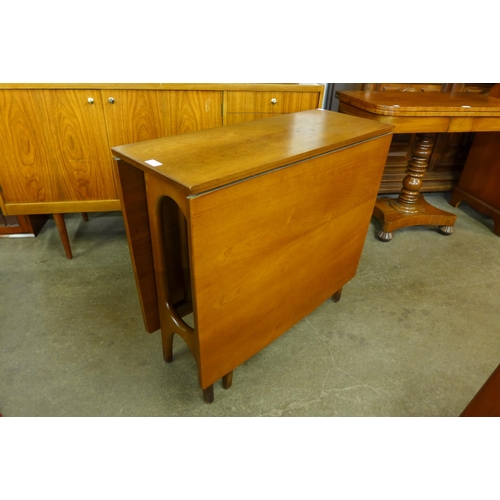 46 - A teak drop-leaf table