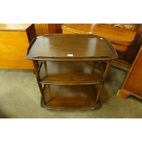 48 - An Ercol Golden Dawn elm and beech Windsor trolley