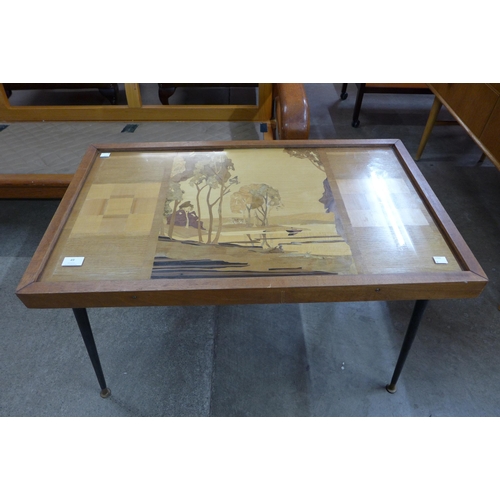 49 - A marquetry inlaid teak coffee table