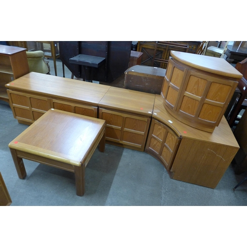 52 - Two Nathan teak corner cupboards, two small cupboards and a coffee table