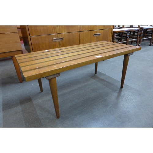 54 - A teak slatted top rectangular coffee table