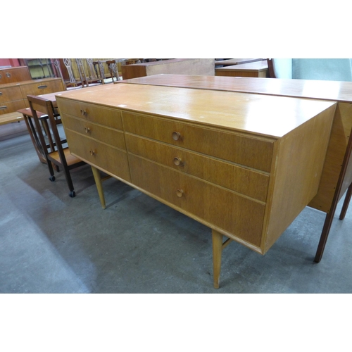 55 - A light oak six drawer sideboard