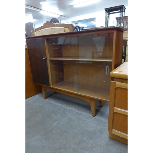 59 - A teak and tola wood bookcase