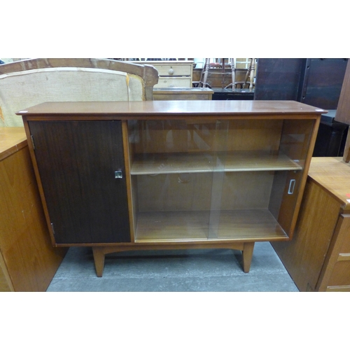 59 - A teak and tola wood bookcase