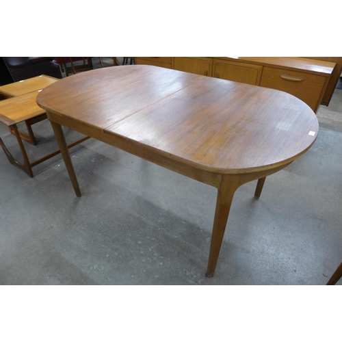 62 - A Nathan teak extending dining table