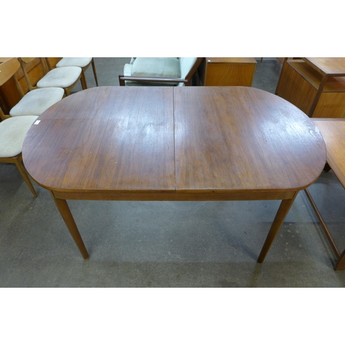 62 - A Nathan teak extending dining table