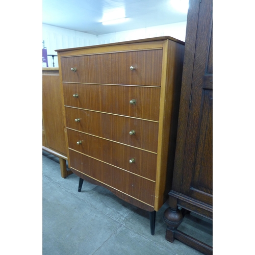 66 - A teak and tola wood chest of drawers