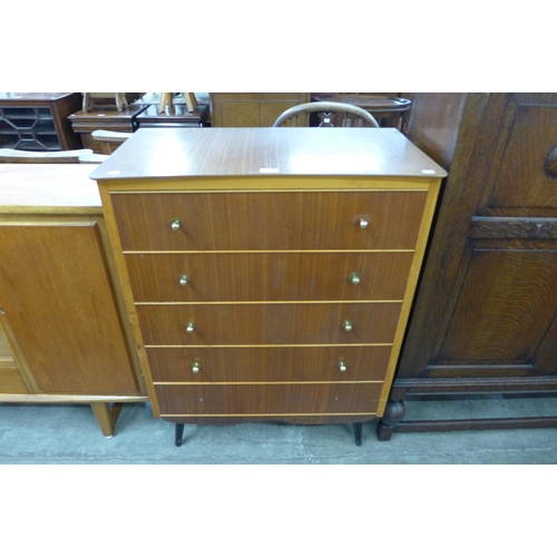 66 - A teak and tola wood chest of drawers