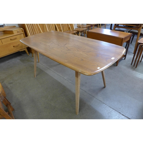 7 - An Ercol Blonde elm and beech plank top Windsor dining table