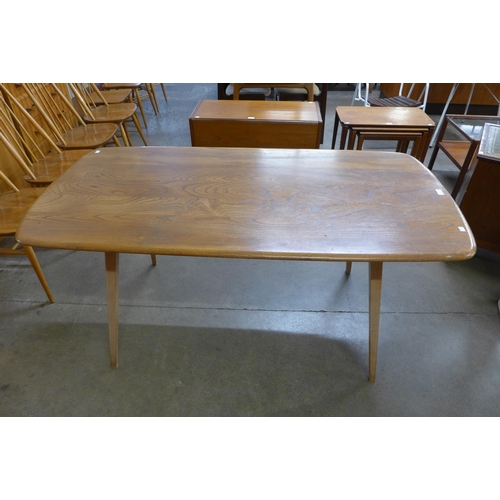 7 - An Ercol Blonde elm and beech plank top Windsor dining table