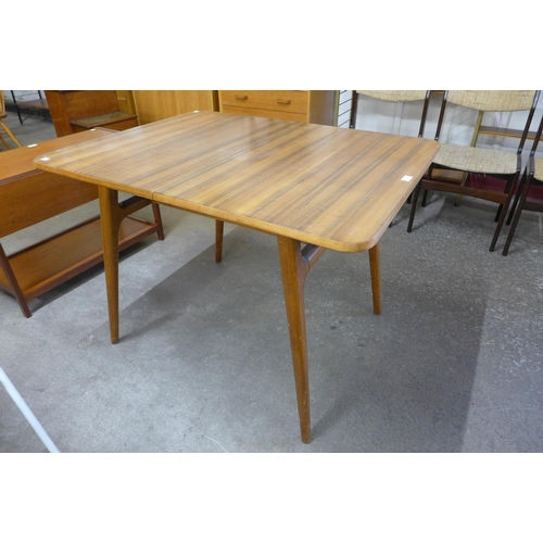 73 - An afromosia extending dining table