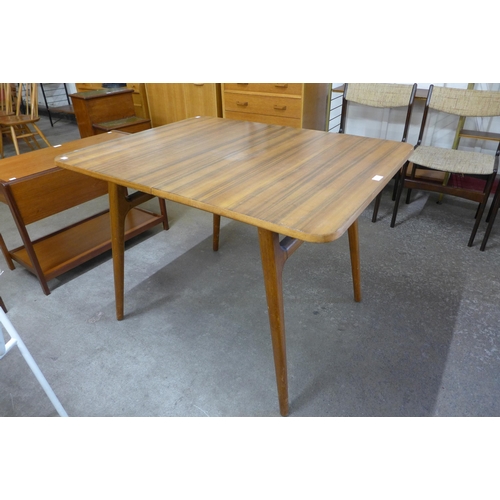 73 - An afromosia extending dining table