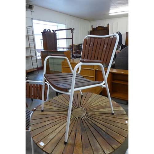 75 - A Danish Daneline teak and white tubular steel garden table and three chairs