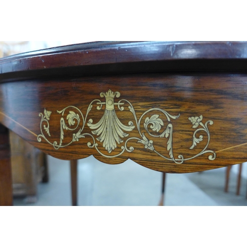 78 - A late Victorian circular rosewood and ivory inlaid centre table. This lot is sold with non-transfer... 