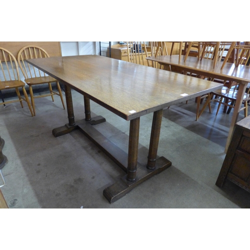 81 - A Heals style oak Churchill refectory table, manner of Philip Tilden