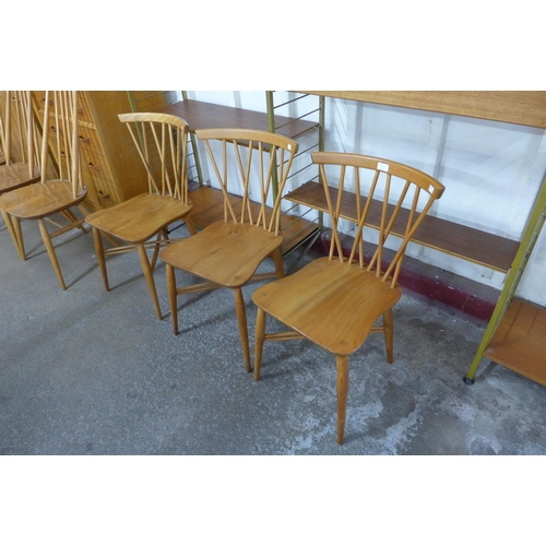 9 - A set of three Ercol Blonde elm and beech candlestick chairs