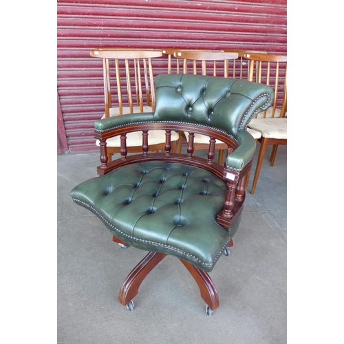 97B - A mahogany and green leather Captains revolving  desk chair