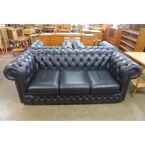 98 - A black leather Chesterfield settee