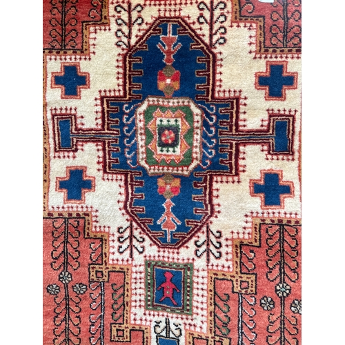 1514 - A terracotta ground, full pile, hand woven Persian rug, 172cm x 112cm