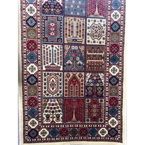 1515 - An ivory ground Cashmere runner, with Persian panel design, 300 x 80cm