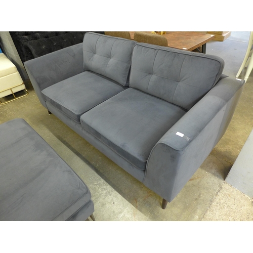 1467 - A slate pinched back velvet three seater sofa