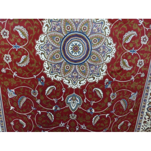 1520 - A red ground full pile Cashmere carpet, central floral medallion, 300 x 200cm