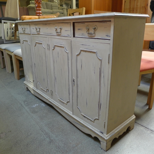 1537 - A painted antique style four door, three drawer sideboard and a jardinière stand