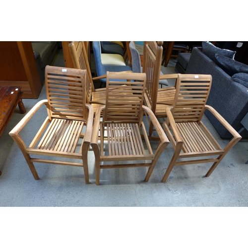 1545 - A set of three teak garden chairs