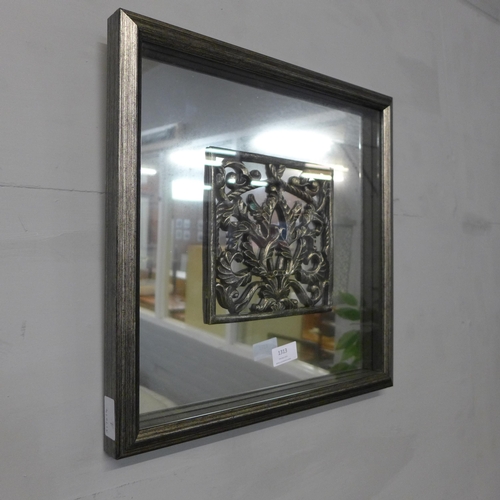 1313 - A glazed decorative mirror