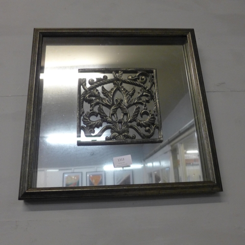 1313 - A glazed decorative mirror