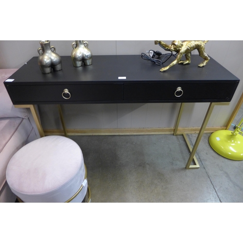 1336 - A black two drawer console table with gold legs, slight damage