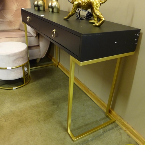 1336 - A black two drawer console table with gold legs, slight damage